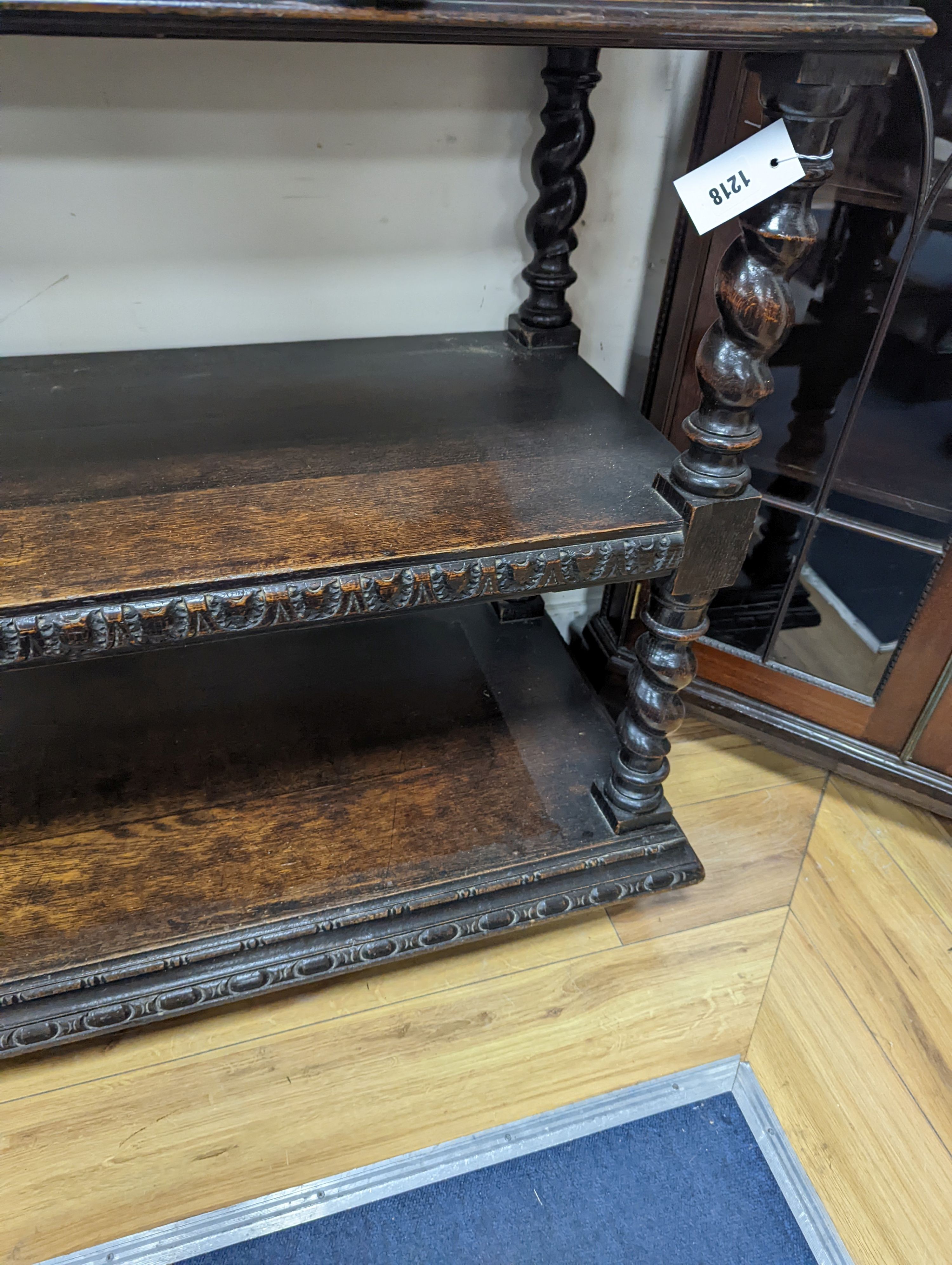 A 19th century Flemish carved oak three tier buffet, length 121cm, depth 46cm, height 98cm